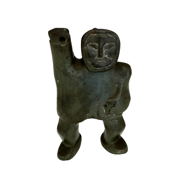 A carved out stone Inuit sculpture