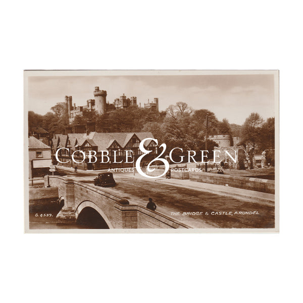 a real photographic sepia postcard of the bridge and castle in Arundel west sussex