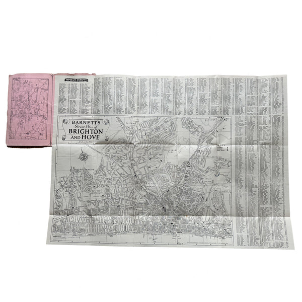 A folded vintage map of Brighton and hove with cover by Barnetts