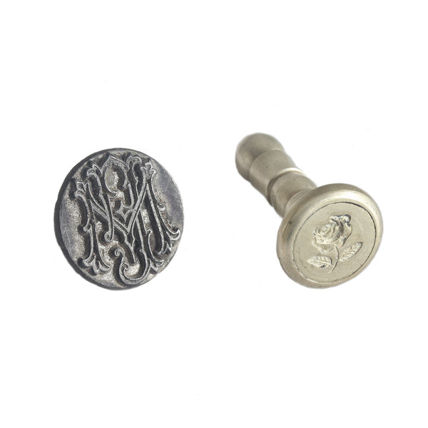 An antique set of two seal wax stamps with a rose and initials engraved