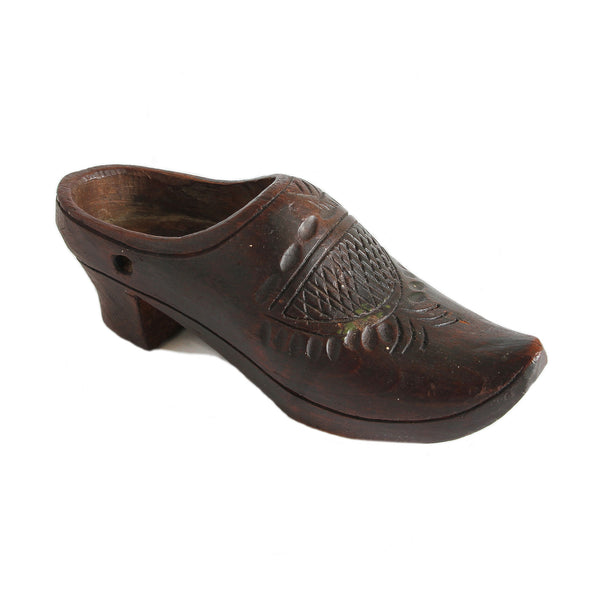 A fine quality secondhand antique miniature wooden clog shoe with pattern on the top