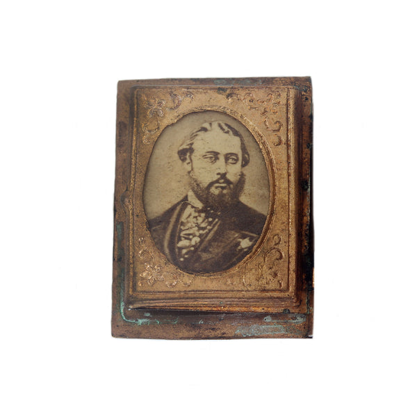 A miniature portrait of a gentleman in victorian clothes brass border