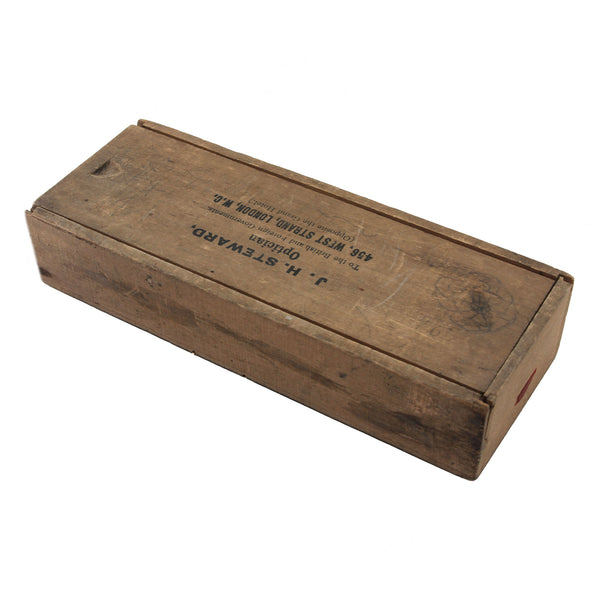 A wooden box with opticians letters inside