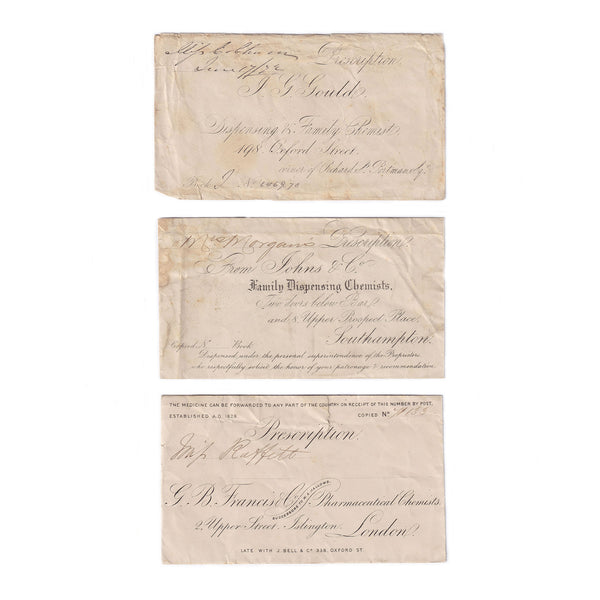 A set of 3 old prescription envelopes from different family dispensing chemists in the uk