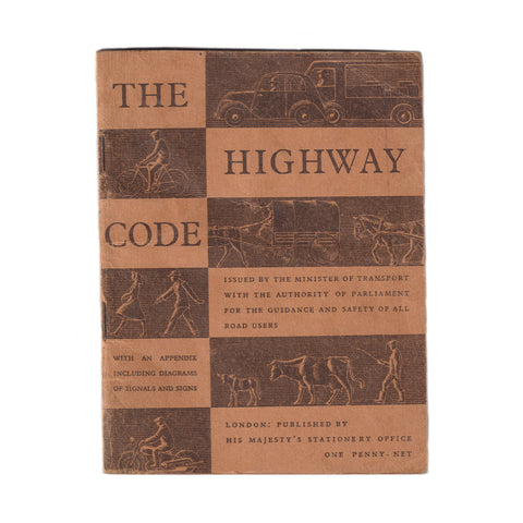 An old vintage 1940s Highway Code booklet in orange with illustrations and text