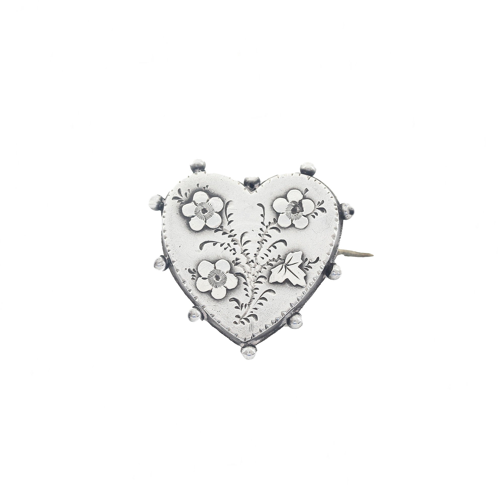 A beautiful silver heart shape floral brooch dated 1894