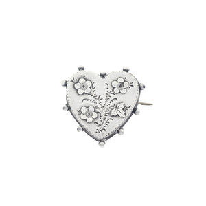 A beautiful silver heart shape floral brooch dated 1894