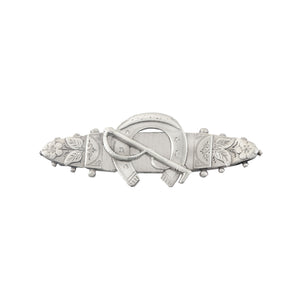 A horseshoe and flower design silver sweetheart brooch dated 1896