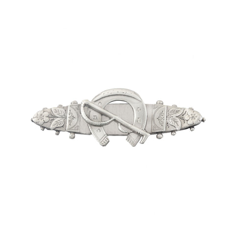 A horseshoe and flower design silver sweetheart brooch dated 1896