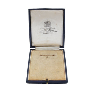 An antique medal display box by Spink and Son of London navy exterior