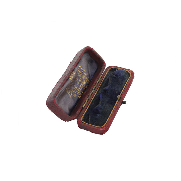 A dark red rectangular display cufflink box by S Smith and Son of Strand