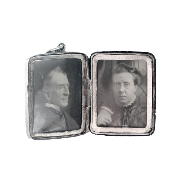 A locket with 2 photographs inside in a silver pendant with footballer