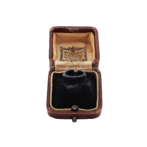 An antique ring presentation box by W J Bayne of Guildford brown leather with raised inside