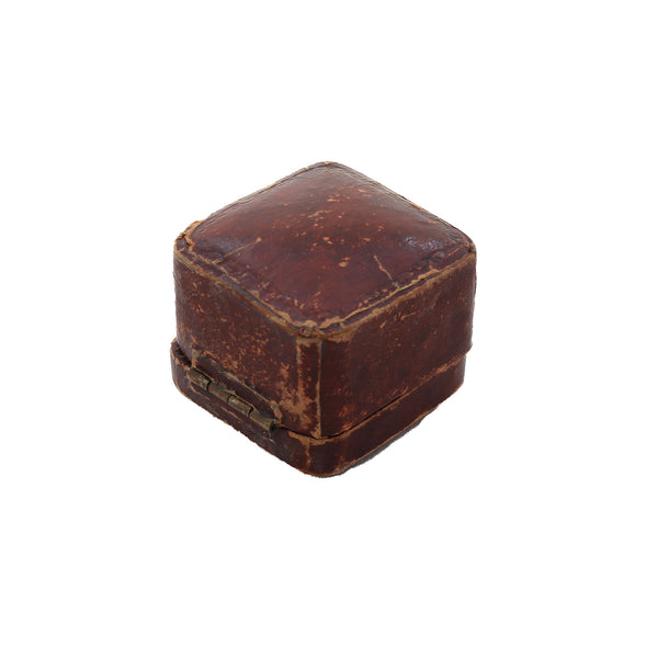 An old antique jewellery ring box in brown square shaped with velvet inside