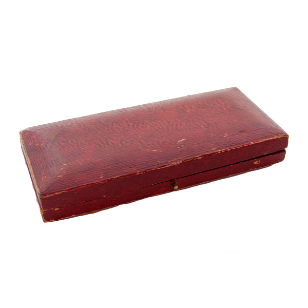 A preowned red rectangular medal watch jewellery display box