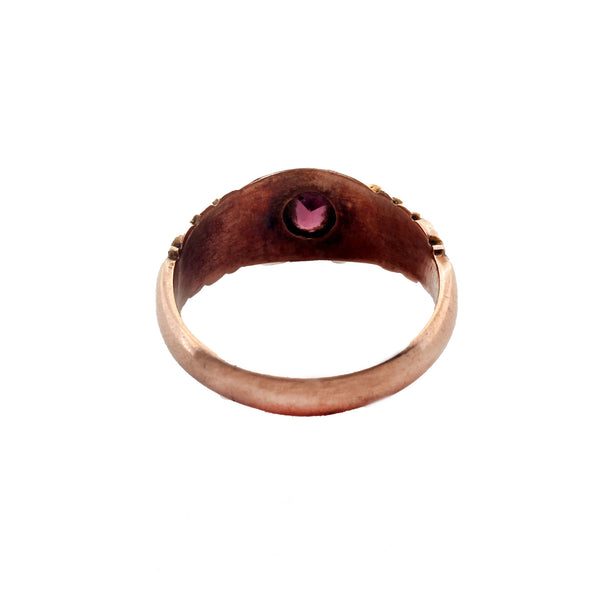 A 9 carat rose gold antique garnet seed pearl 7 stone ring