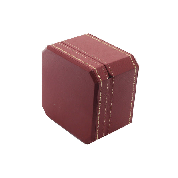 A preowned red leather box for rings by cartier with gold fancy border