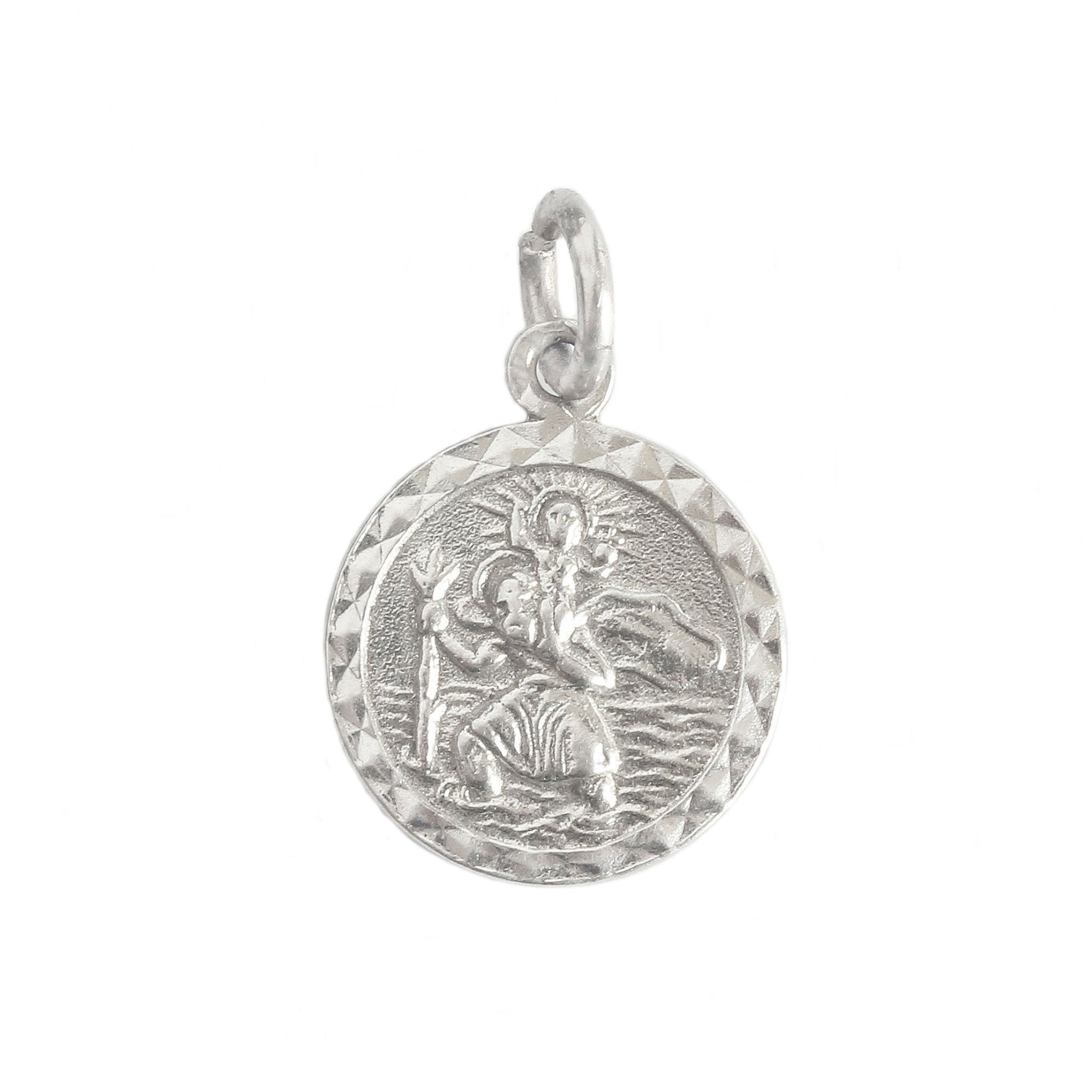 A small round diamond cut Saint Christopher pendant in silver