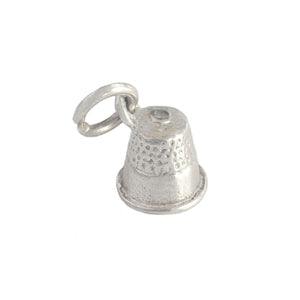 A vintage secondhand sterling silver tiny thimble charm