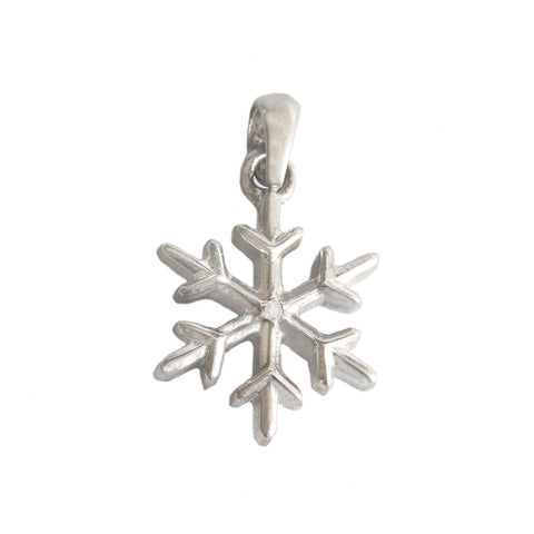 A silver vintage snowflake charm pendant with a tiny central diamond