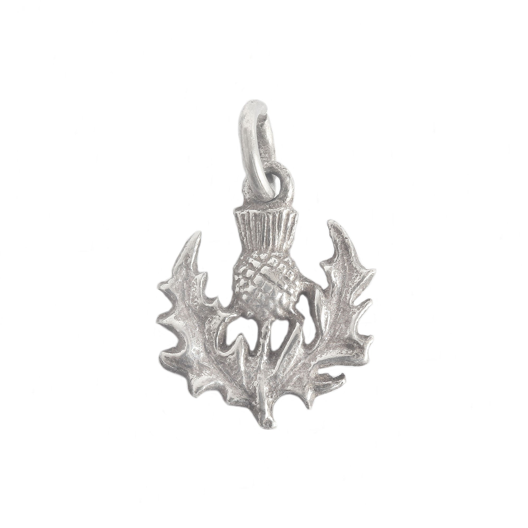 A vintage sterling silver thistle detailed charm