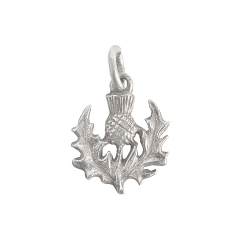 A vintage sterling silver thistle detailed charm