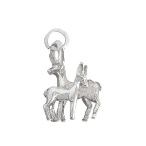 A secondhand silver charm of a deer and fawn together