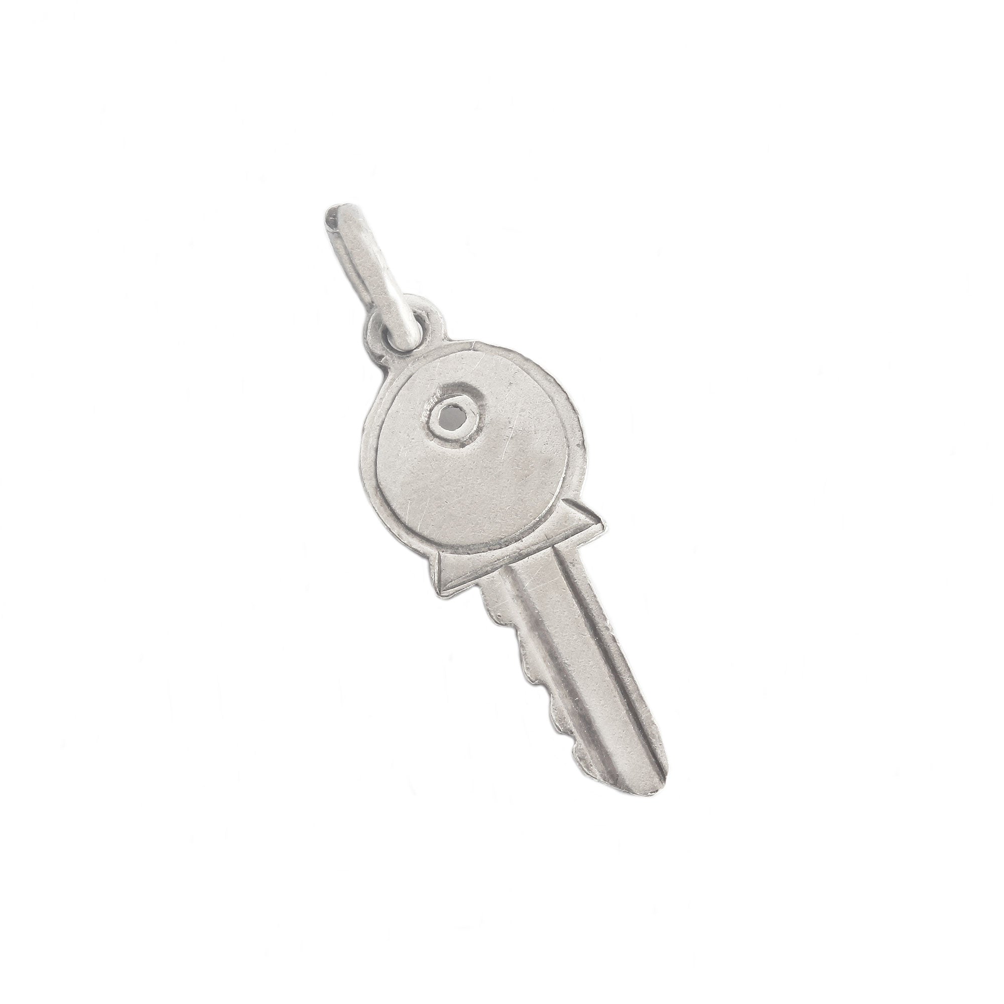 A sterling silver vintage plain modern key charm 