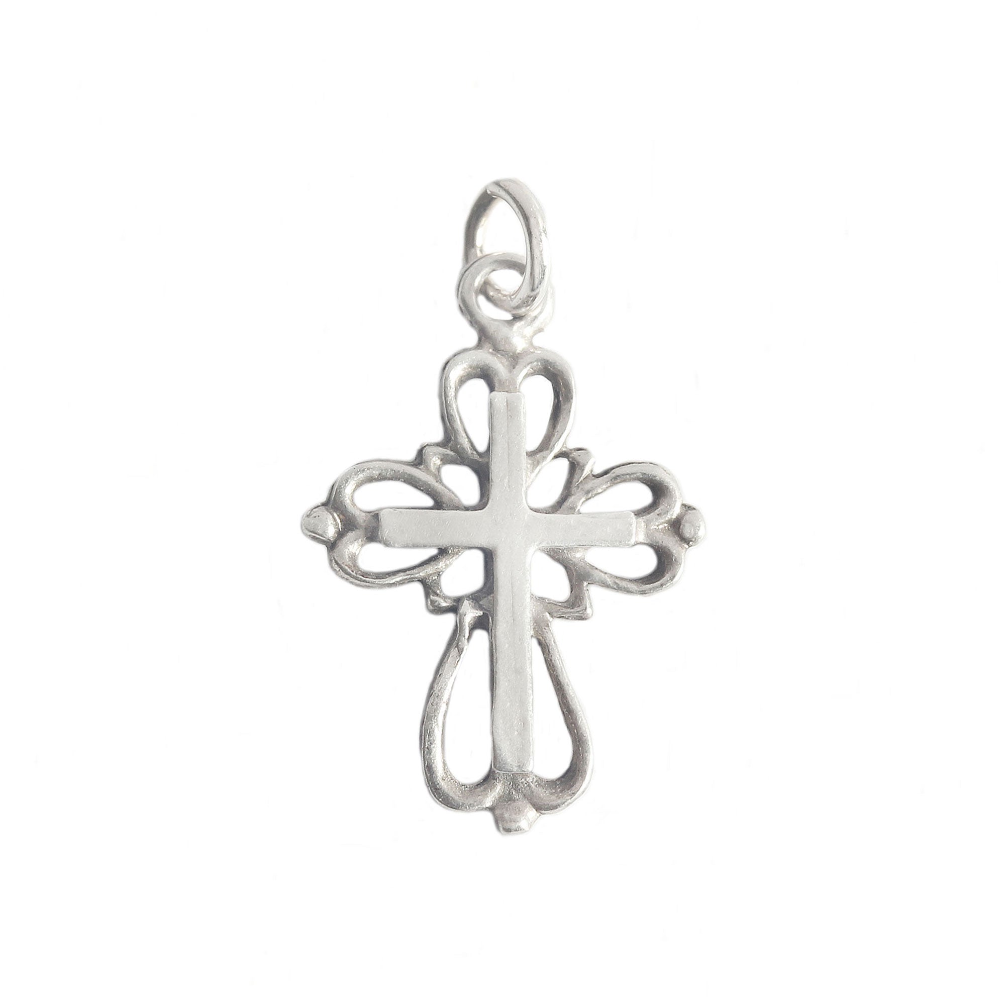 A vintage sterling silver decorative small cross pendant