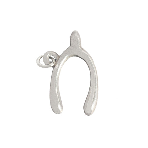 A vintage sterling silver wishbone charm