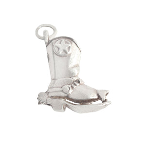 A secondhand vintage silver cowboy boot with lasso opening charm