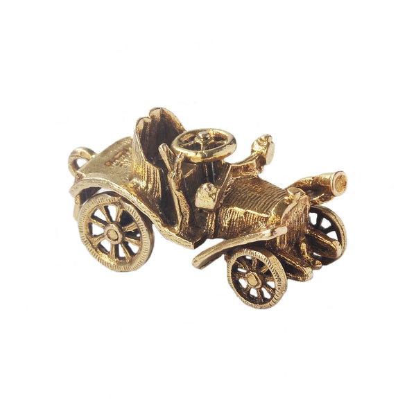 A superb vintage gold charm in shape of an old car dated 1962