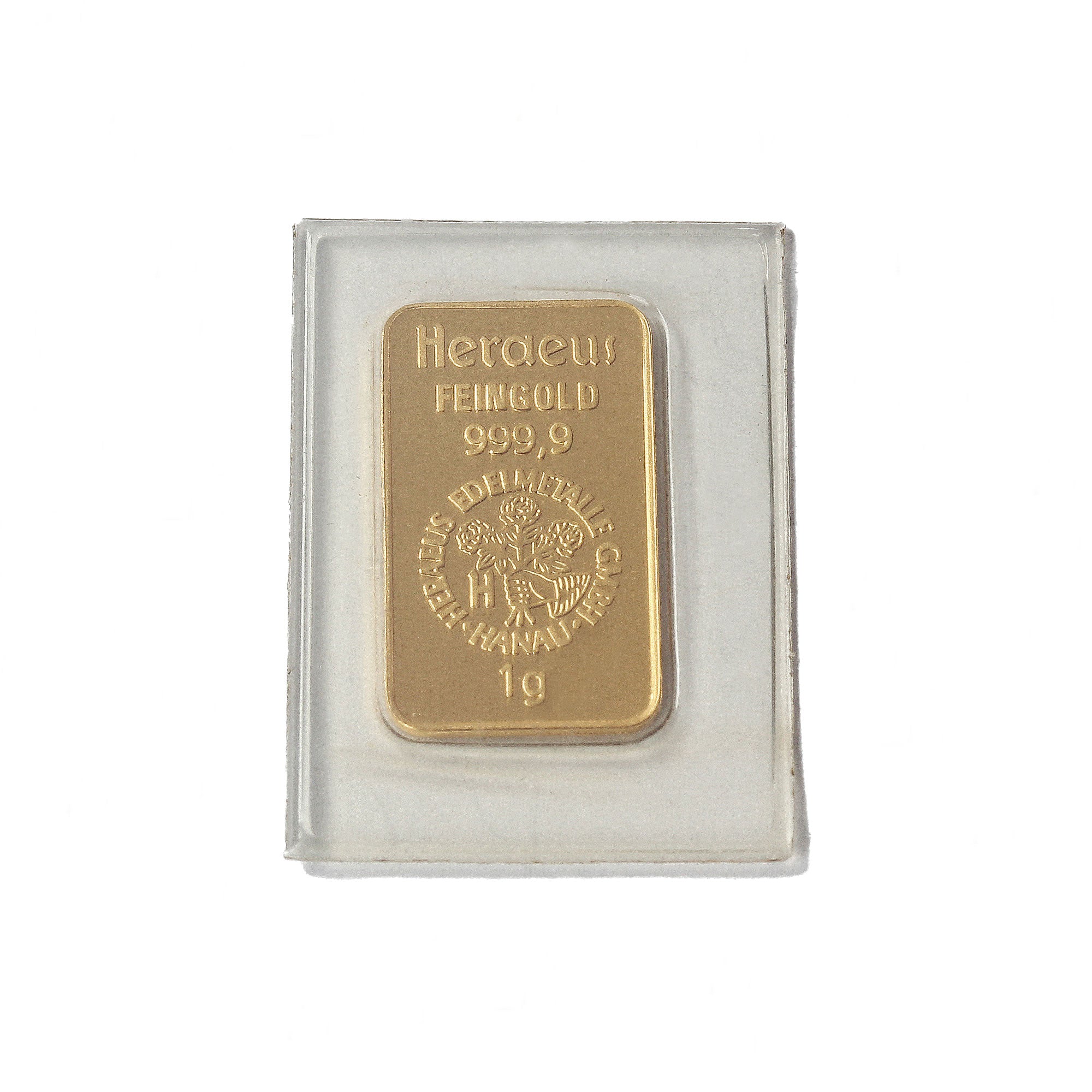 A tiny gold bar with Heraeus feingold 999,9 written on 1g plain on the back