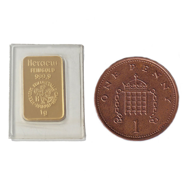 A gold 1 gram bar in a plastic case miniature 