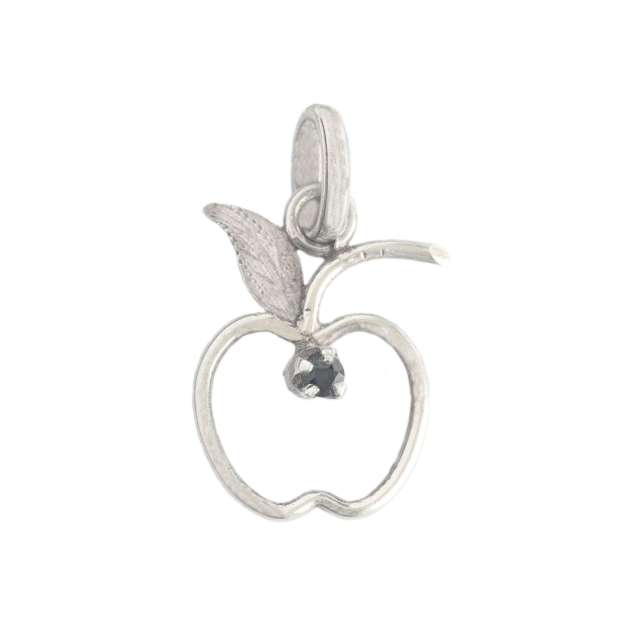 A silver preowned cut out apple charm with small sapphire 