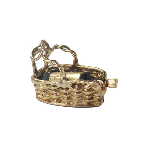 A gold burgundy bottle in a basket charm vintage and hallmarked London 1960