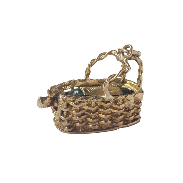 A superb vintage gold charm in a weave basket with burgundy written on the top