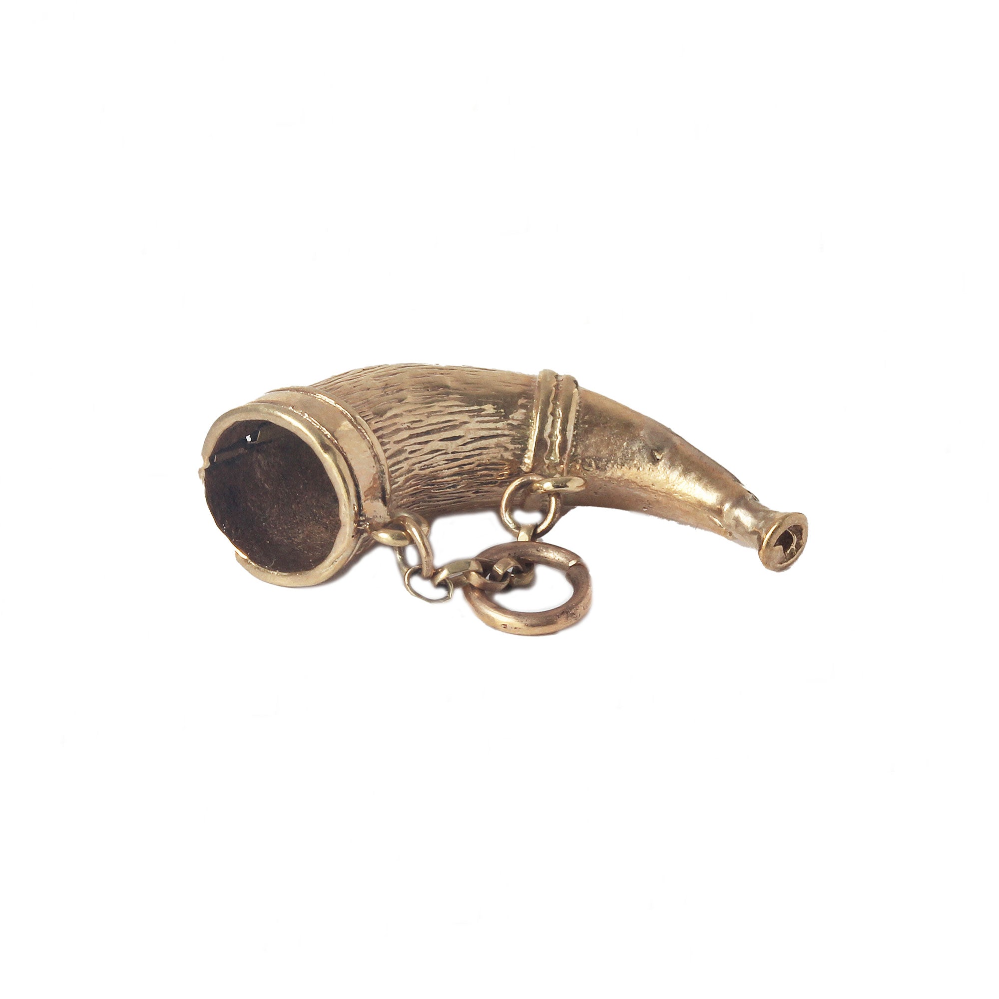 A patterned yellow gold horn charm with small safety chain dated 1974