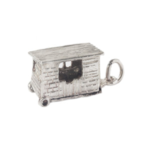 A vintage silver horse inside a horsebox charm opens hinged