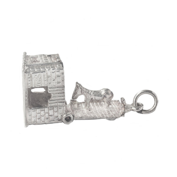 A horse inside a horsebox vintage silver charm