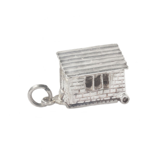 A vintage silver novelty charm with horse inside horsebox