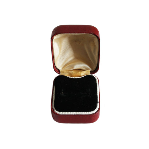 A plain ring box for engagement ring with silk and velvet interior