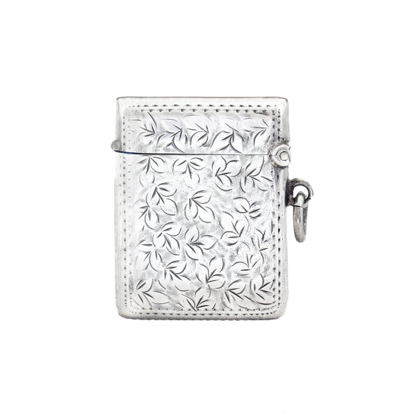 A leaf pattern vesta case in silver with shield cartouche initials LG dated 1911