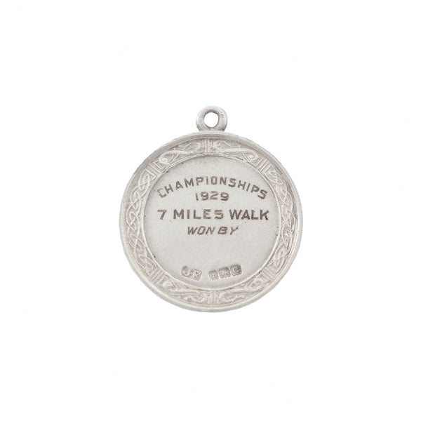 A solid silver championships 7 mile walk silver medal 