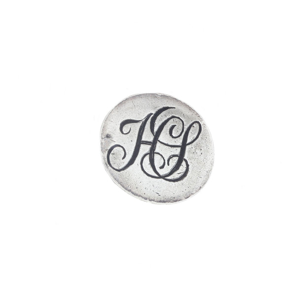 An antique silver fob seal with H V initials dated 1911