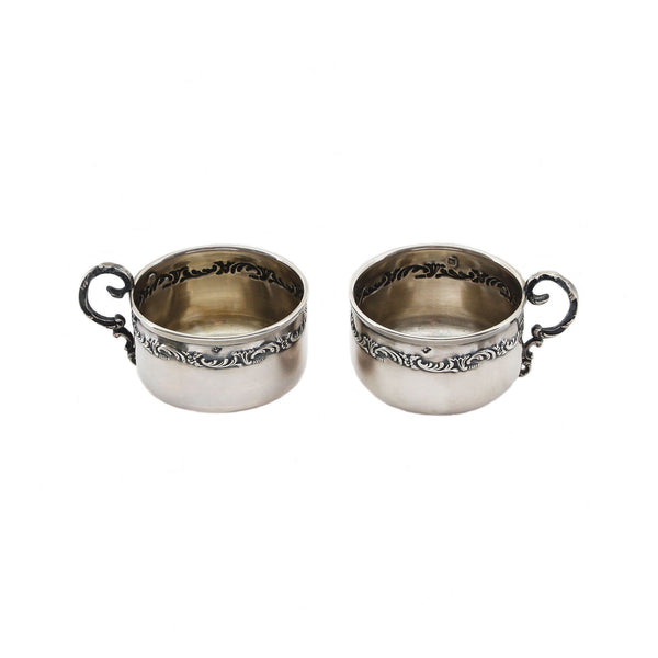 A silver antique French pair of cup and saucers miniature in size