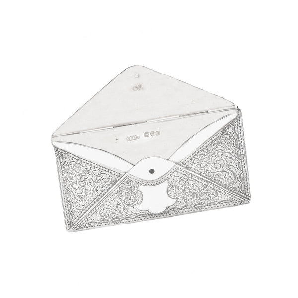 A secondhand silver business card holder in shape of envelope