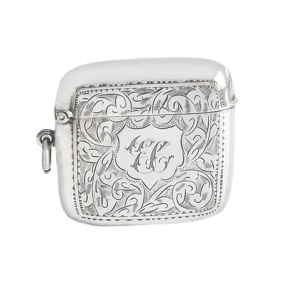 An Edwardian silver vesta case and cigarette holder with initials and pattern dated 1906