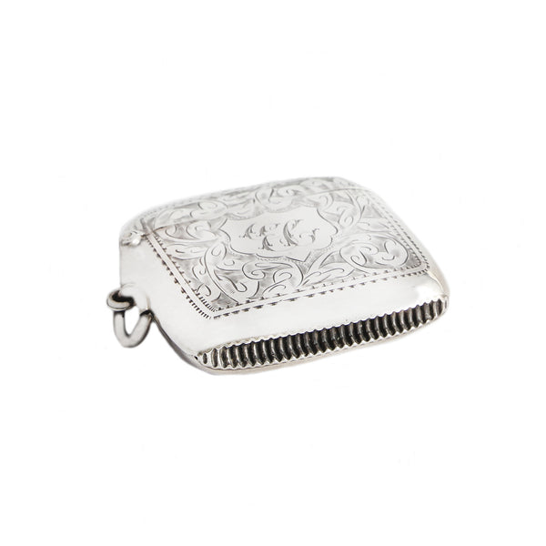 A fine quality antique vesta case in solid silver with cigarette holder dated 1906