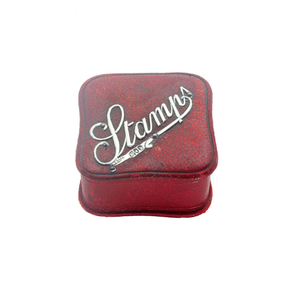 A silver mounted red stamp box leather dated 1901